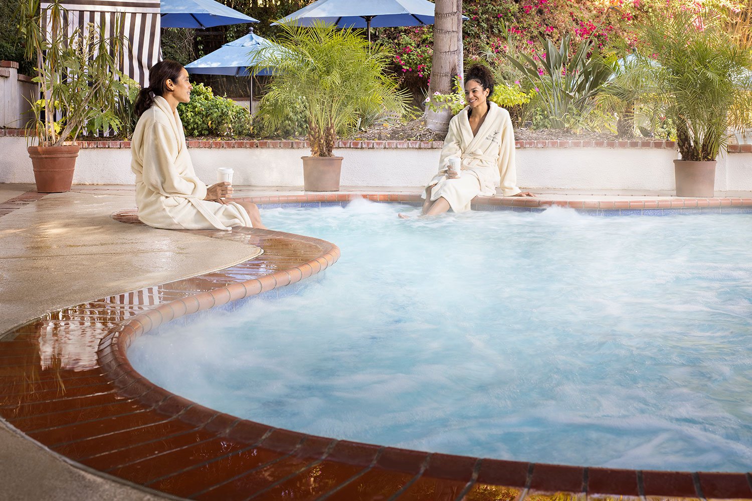 two women enjoying the pool